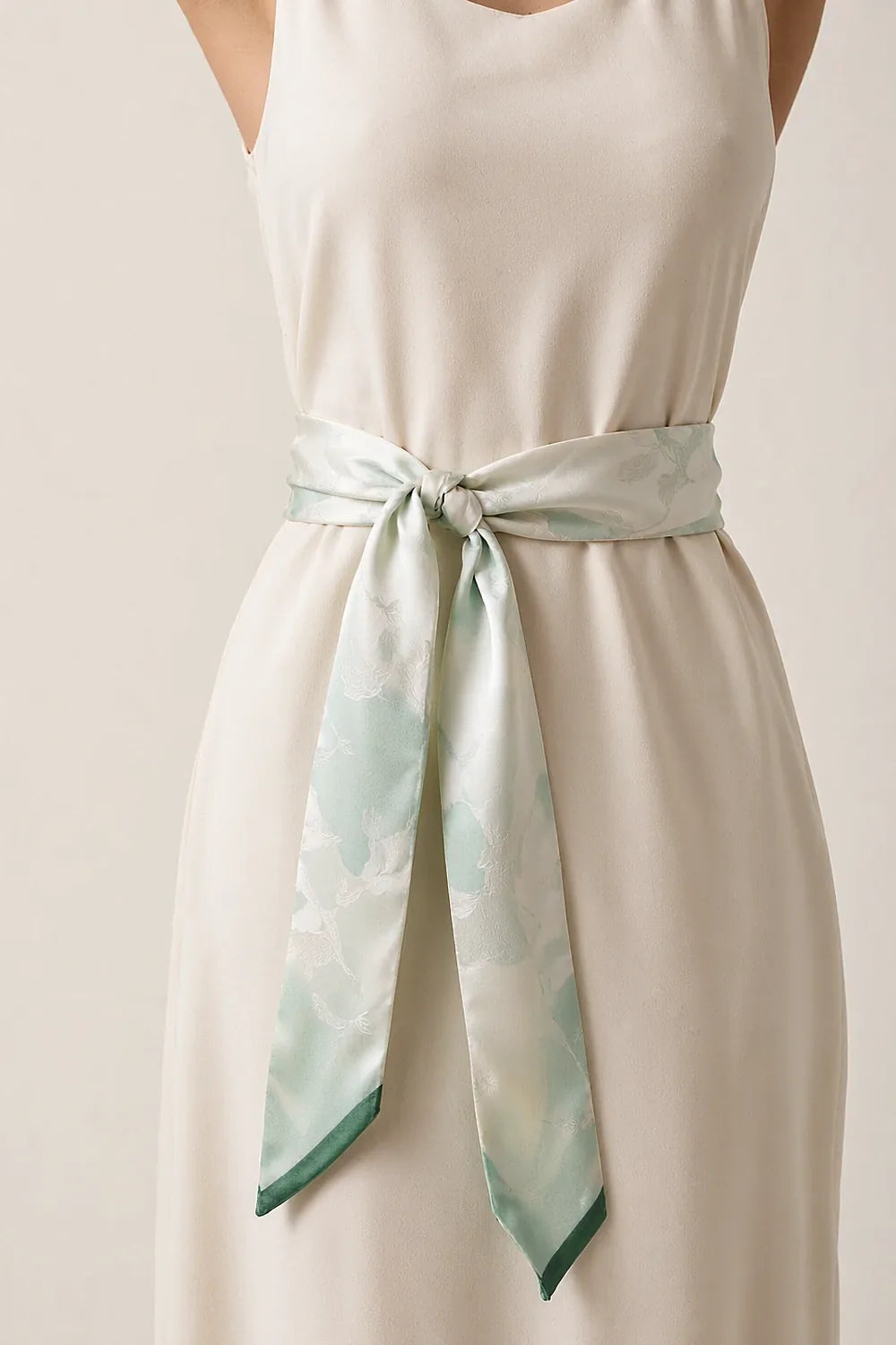 Silk scarf worn as a belt over a shift dress