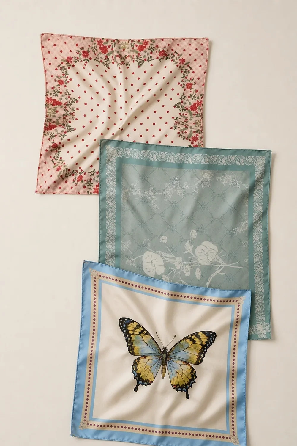 Three silk scarves showing small, medium and large print scale