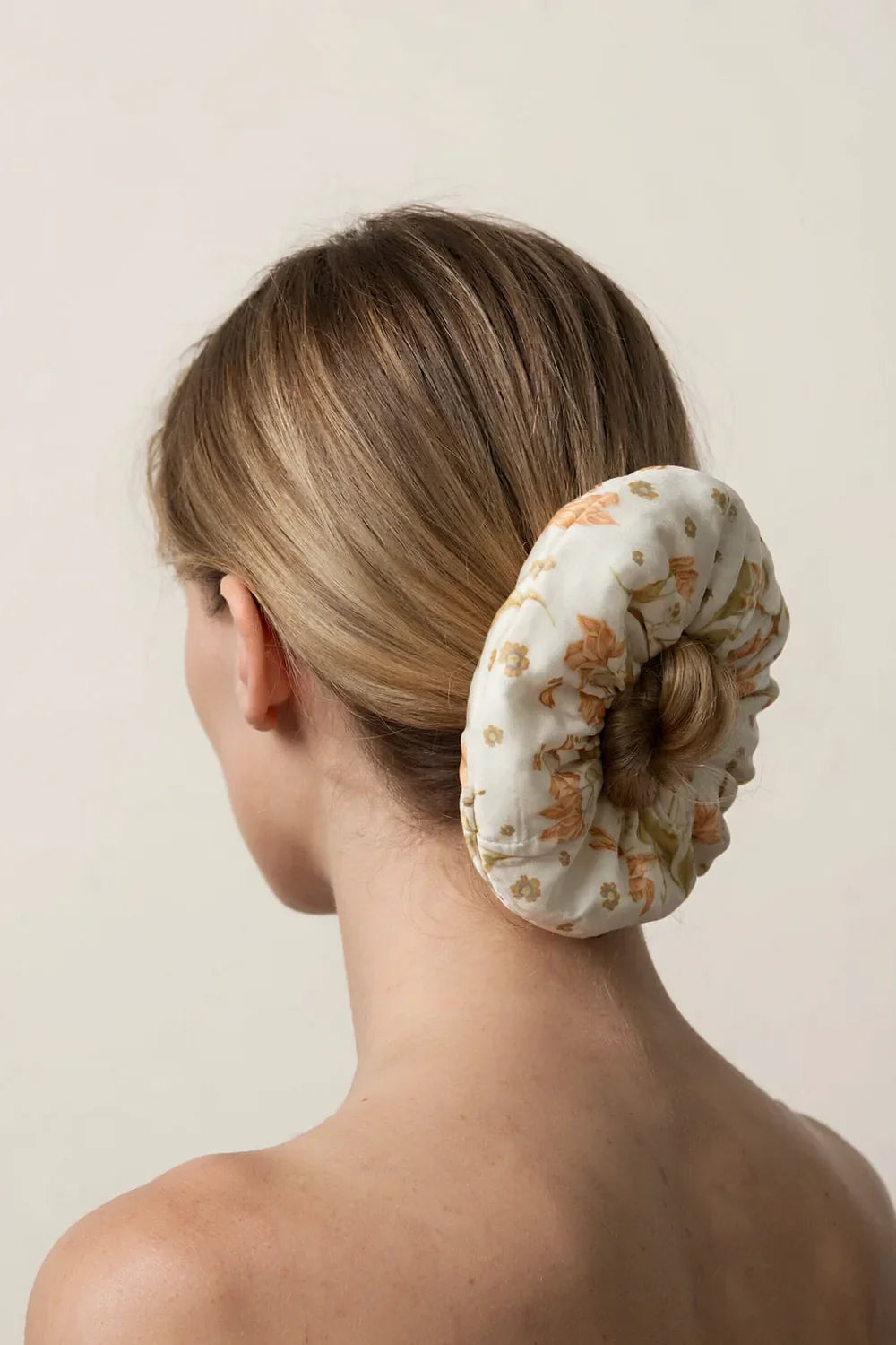 Ten ways to wear a silk scrunchie shown in a grid