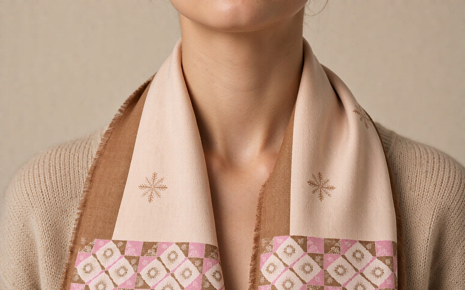 Silk-wool scarf resting against the neck, warm neutral studio light