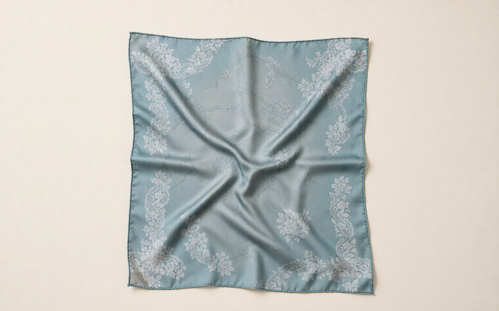 Botanical print silk square laid flat like a piece of wearable art